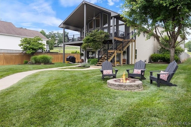 30594 Johnson Bay Rd, Gravois Mills, MO 65037 - rear view of house featuring an outdoor fire pit, stairway, a wooden deck, and ceiling fan