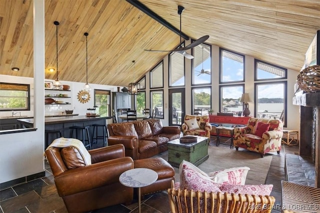 30594 Johnson Bay Rd, Gravois Mills, MO 65037 - living room featuring high vaulted ceiling, wood ceiling, a ceiling fan, and stone tile flooring