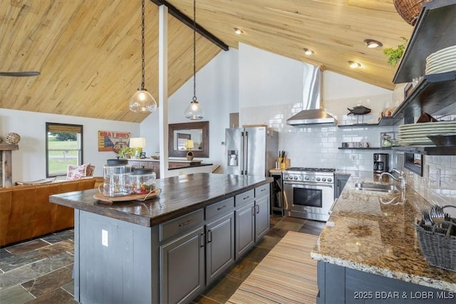 30594 Johnson Bay Rd, Gravois Mills, MO 65037 - kitchen with stainless steel appliances, open shelves, open floor plan, dark stone counters, and wall chimney exhaust hood