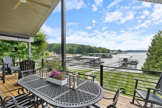 30594 Johnson Bay Rd, Gravois Mills, MO 65037 - balcony featuring a water view, a ceiling fan, and outdoor dining area