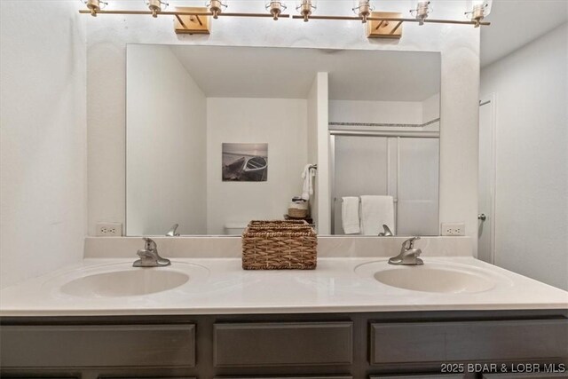 30594 Johnson Bay Rd, Gravois Mills, MO 65037 - full bathroom featuring double vanity and a shower with door