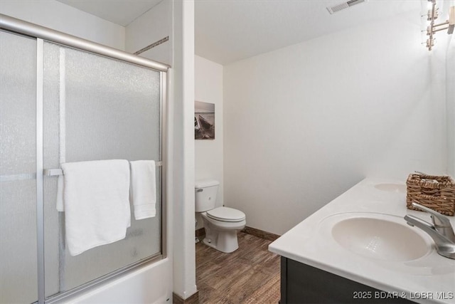 30594 Johnson Bay Rd, Gravois Mills, MO 65037 - full bathroom with wood finished floors, double vanity, and shower / bath combination with glass door