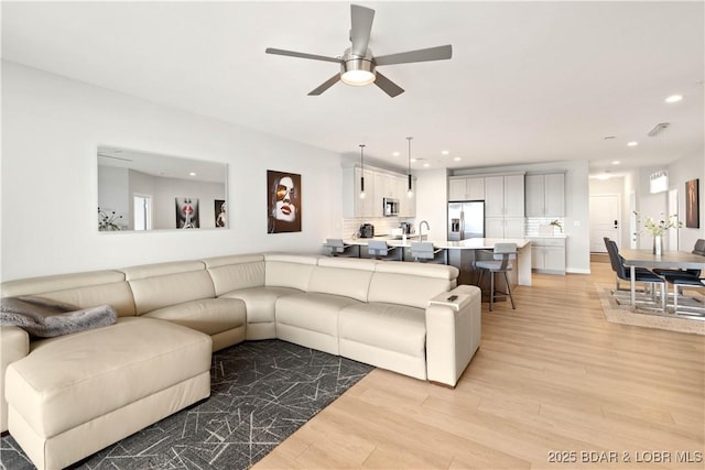 166 Captiva Dr Unit 5D, Sunrise Beach, MO 65079 - living area with light wood-style flooring, ceiling fan, and recessed lighting