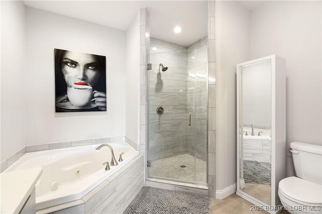 166 Captiva Dr Unit 5D, Sunrise Beach, MO 65079 - bathroom featuring a jetted tub and a shower stall