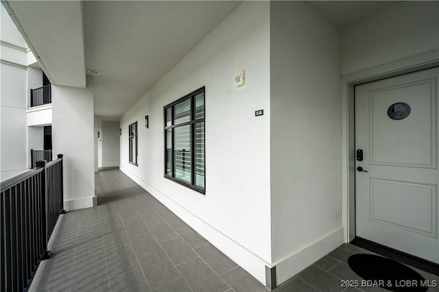 166 Captiva Dr Unit 5D, Sunrise Beach, MO 65079 - property entrance with stucco siding and a balcony