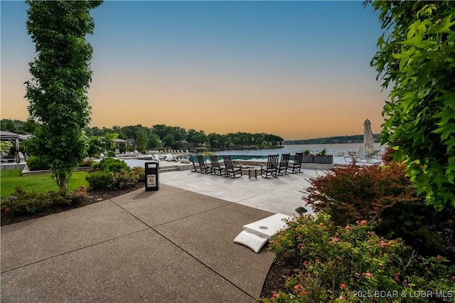 166 Captiva Dr Unit 5D, Sunrise Beach, MO 65079 - view of patio featuring a water view and an outdoor pool