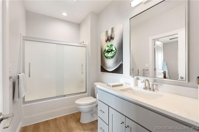 166 Captiva Dr Unit 5D, Sunrise Beach, MO 65079 - bathroom with vanity, shower / bath combination with glass door, and wood finished floors