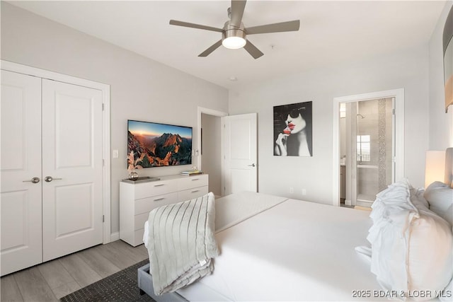 166 Captiva Dr Unit 5D, Sunrise Beach, MO 65079 - bedroom with light wood finished floors, ensuite bathroom, ceiling fan, and a closet