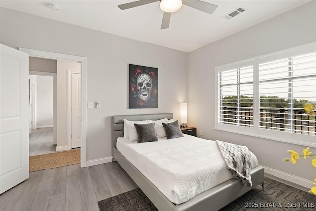 166 Captiva Dr Unit 5D, Sunrise Beach, MO 65079 - bedroom featuring wood finished floors and ceiling fan