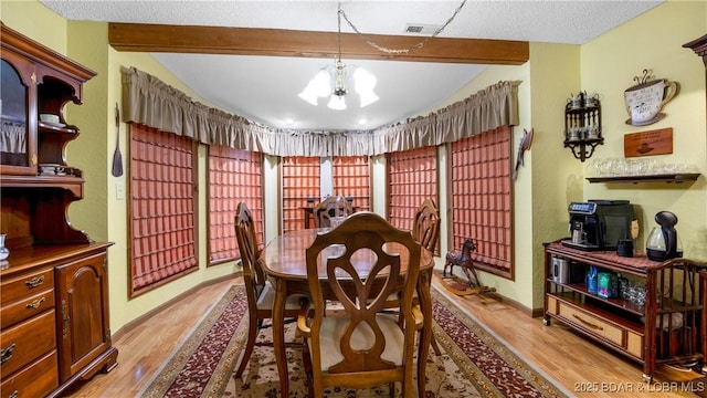 87 Outback Loop, Linn Creek, MO 65052 - dining room with a chandelier and light wood-style flooring