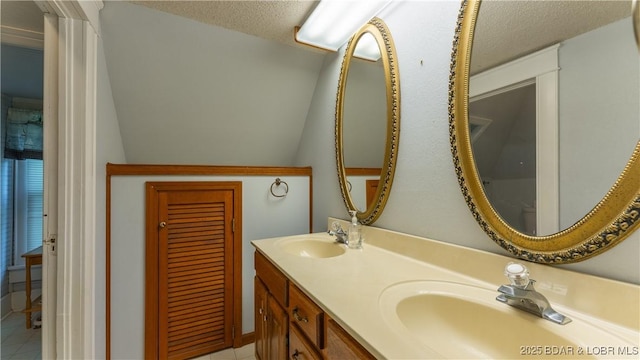 87 Outback Loop, Linn Creek, MO 65052 - bathroom with double vanity and a textured ceiling