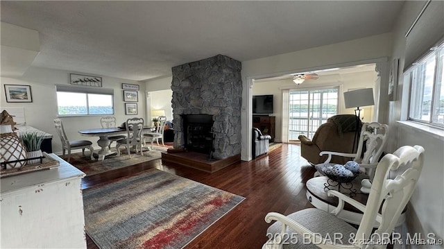 28136 Lyndsey Ln, Rocky Mount, MO 65072 - living room featuring wood finished floors, ceiling fan, and a stone fireplace