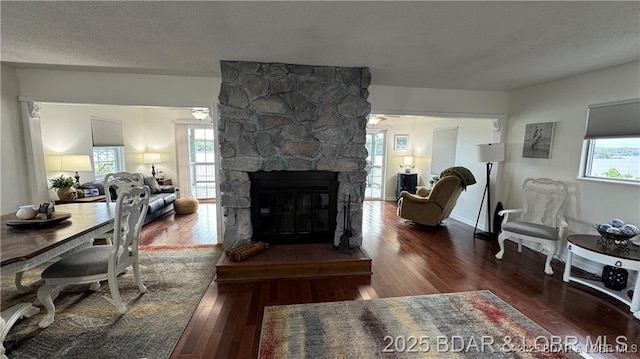 28136 Lyndsey Ln, Rocky Mount, MO 65072 - living room with hardwood / wood-style flooring and a stone fireplace