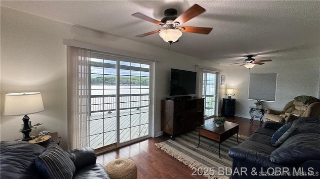 28136 Lyndsey Ln, Rocky Mount, MO 65072 - living room featuring ceiling fan, a textured ceiling, and wood finished floors