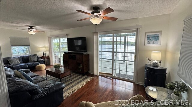 28136 Lyndsey Ln, Rocky Mount, MO 65072 - living room featuring a ceiling fan, a textured ceiling, and wood finished floors
