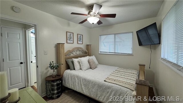 28136 Lyndsey Ln, Rocky Mount, MO 65072 - bedroom with multiple windows and a ceiling fan