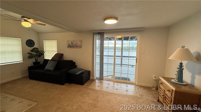 28136 Lyndsey Ln, Rocky Mount, MO 65072 - living area with ceiling fan, carpet, and a textured ceiling
