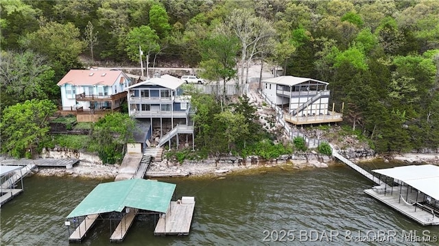 28136 Lyndsey Ln, Rocky Mount, MO 65072 - dock area featuring stairs, a water view, and a forest view