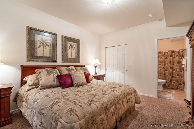 440 Cedar Heights Dr Unit 1C, Camdenton, MO 65020 - carpeted bedroom with ensuite bathroom and baseboards