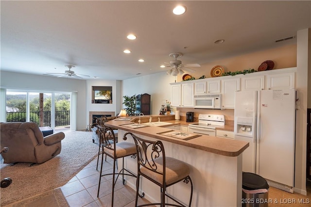 440 Cedar Heights Dr Unit 1C, Camdenton, MO 65020 - kitchen featuring white appliances, ceiling fan, open floor plan, and recessed lighting