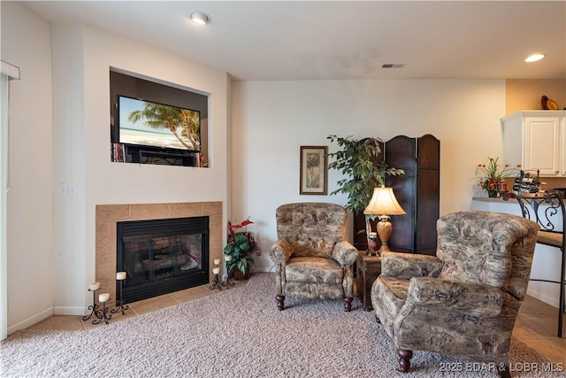 440 Cedar Heights Dr Unit 1C, Camdenton, MO 65020 - sitting room featuring a tiled fireplace and recessed lighting