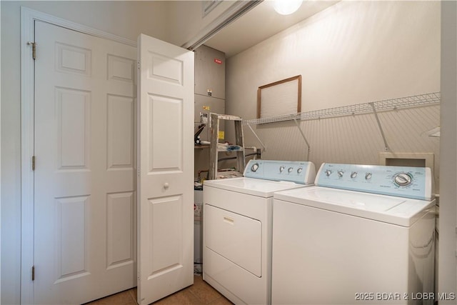440 Cedar Heights Dr Unit 1C, Camdenton, MO 65020 - laundry room featuring washer and clothes dryer and light tile patterned floors