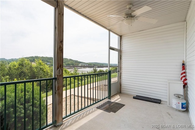 440 Cedar Heights Dr Unit 1C, Camdenton, MO 65020 - unfurnished sunroom with a water view and ceiling fan