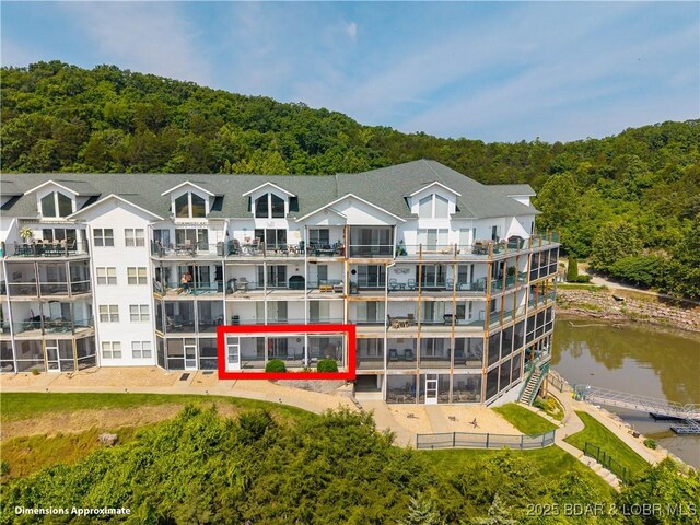 440 Cedar Heights Dr Unit 1C, Camdenton, MO 65020 - view of apartment building / complex with a water view and a wooded view