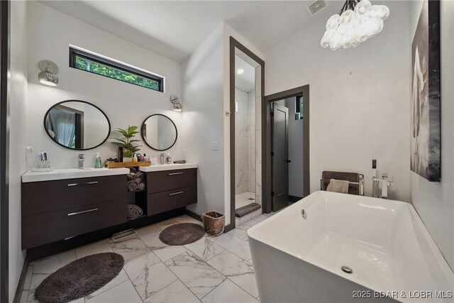 626 Eagle Dr, Four Seasons, MO 65049 - full bath with double vanity, marble look tiles, a stall shower, a soaking tub, and a chandelier