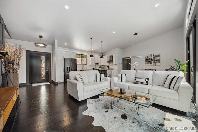 626 Eagle Dr, Four Seasons, MO 65049 - living room with dark wood finished floors, recessed lighting, and vaulted ceiling