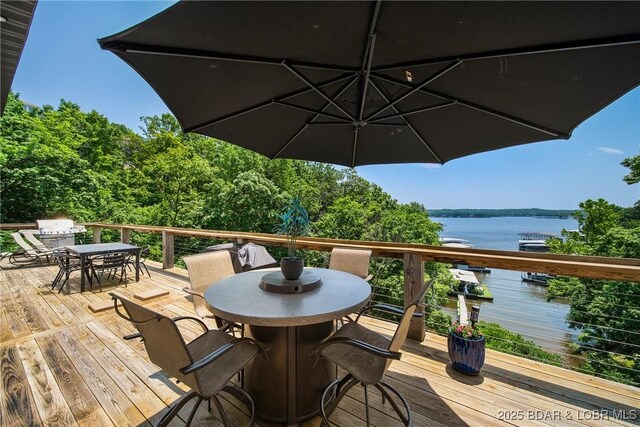 626 Eagle Dr, Four Seasons, MO 65049 - wooden terrace featuring outdoor dining space, a water view, and area for grilling