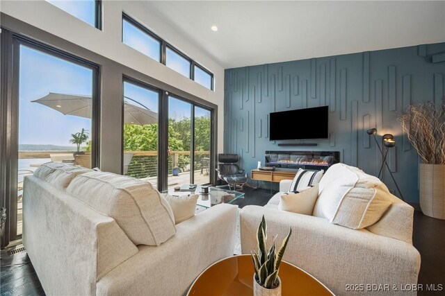626 Eagle Dr, Four Seasons, MO 65049 - living area with dark wood-style floors, recessed lighting, and a towering ceiling