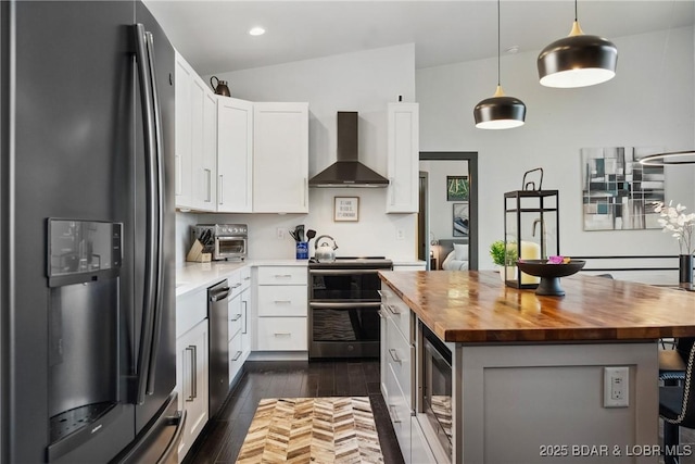 626 Eagle Dr, Four Seasons, MO 65049 - kitchen featuring appliances with stainless steel finishes, butcher block countertops, wall chimney exhaust hood, white cabinets, and dark wood-style floors
