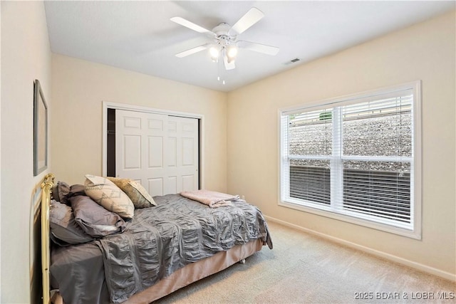 34 Bristol Bay Dr Unit 1C, Lake Ozark, MO 65049 - carpeted bedroom with a closet and a ceiling fan
