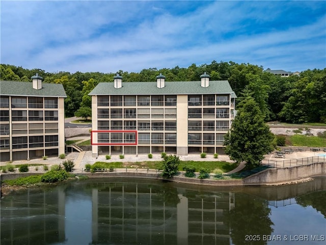 34 Bristol Bay Dr Unit 1C, Lake Ozark, MO 65049 - view of building exterior with a water view
