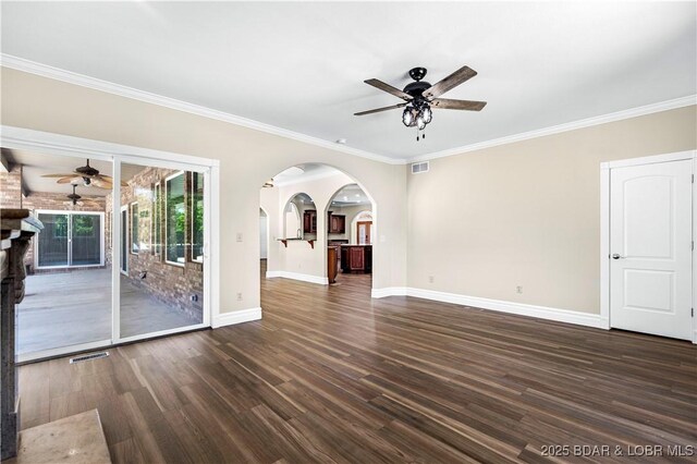 82 Fawn Meadows Dr, Linn Creek, MO 65052 - unfurnished living room with ceiling fan, wood finished floors, ornamental molding, and arched walkways