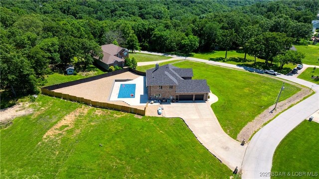 82 Fawn Meadows Dr, Linn Creek, MO 65052 - aerial view of property and surrounding area featuring a heavily wooded area and a pool area