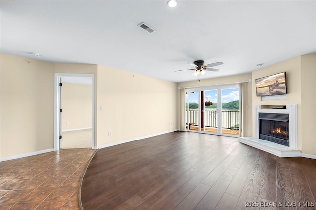 238 Cedar Glen Dr Unit 3F, Camdenton, MO 65020 - unfurnished living room featuring a ceiling fan, a lit fireplace, and recessed lighting