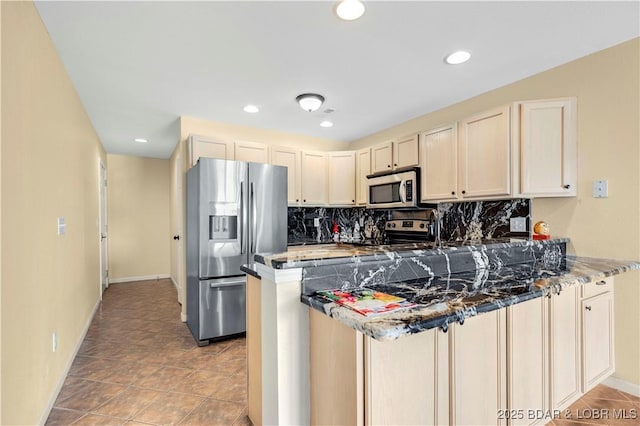 238 Cedar Glen Dr Unit 3F, Camdenton, MO 65020 - kitchen featuring stainless steel appliances, a peninsula, decorative backsplash, recessed lighting, and cream cabinets