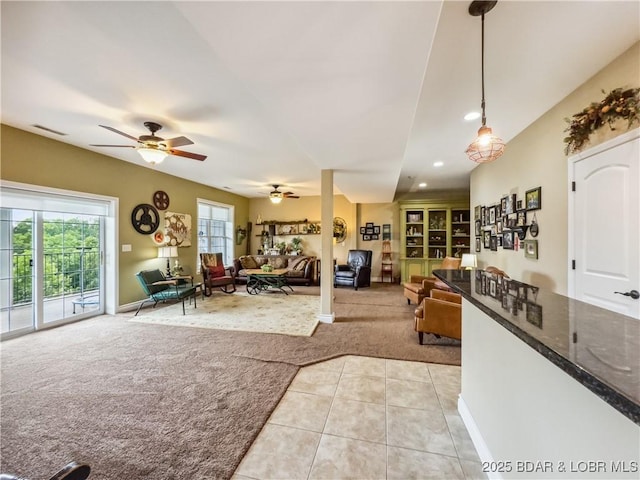 172 Highland Pkwy, Camdenton, MO 65020 - living area with light carpet, a ceiling fan, light tile patterned flooring, and recessed lighting