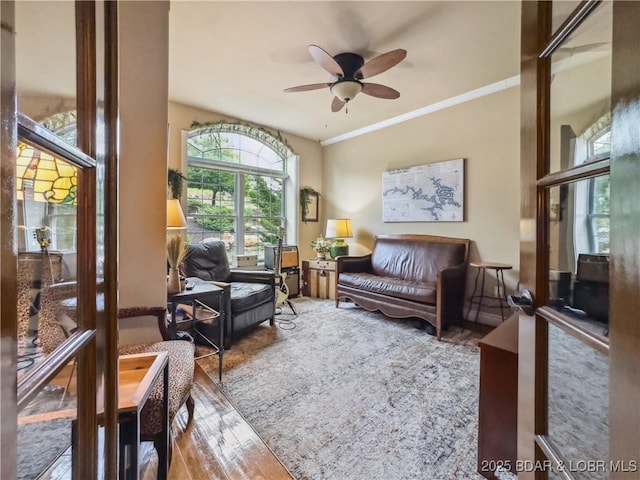 172 Highland Pkwy, Camdenton, MO 65020 - living area with a ceiling fan, wood finished floors, and crown molding