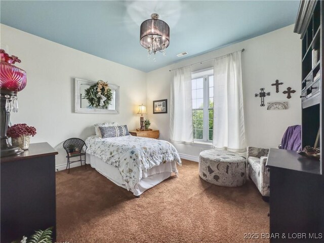 172 Highland Pkwy, Camdenton, MO 65020 - bedroom with a chandelier and carpet