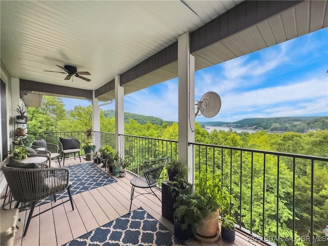 172 Highland Pkwy, Camdenton, MO 65020 - wooden deck featuring a ceiling fan and a forest view