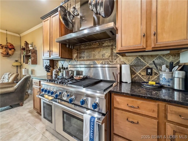 172 Highland Pkwy, Camdenton, MO 65020 - kitchen featuring range with two ovens, wall chimney exhaust hood, ornamental molding, decorative backsplash, and dark stone counters