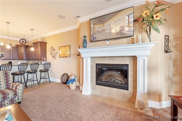 1184 Jeffries Rd Unit 113, Osage Beach, MO 65065 - living area featuring ornamental molding and a tiled fireplace