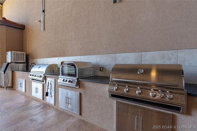 1184 Jeffries Rd Unit 113, Osage Beach, MO 65065 - view of patio with an outdoor kitchen