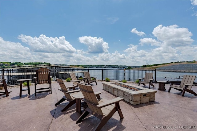 1184 Jeffries Rd Unit 113, Osage Beach, MO 65065 - view of patio featuring a fire pit and a water view