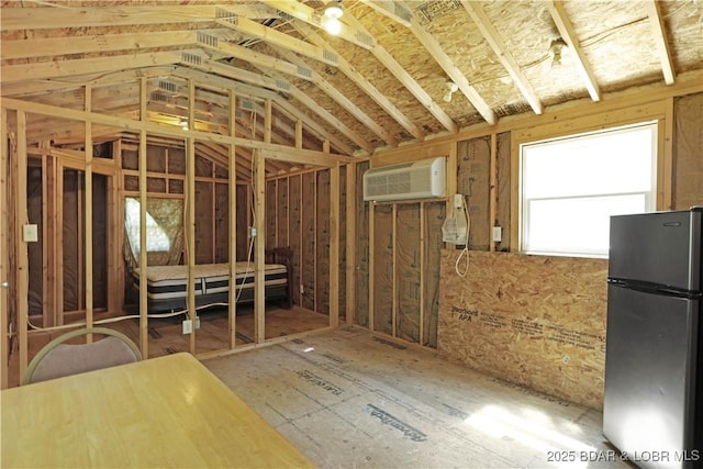 3737 Walnut Hills Rd, Stover, MO 65078 - miscellaneous room with an AC wall unit and vaulted ceiling