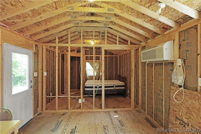 3737 Walnut Hills Rd, Stover, MO 65078 - miscellaneous room with a wall mounted air conditioner and vaulted ceiling