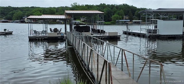 30141 Gentle Cv, Gravois Mills, MO 65037 - dock area featuring a water view and a wooded view